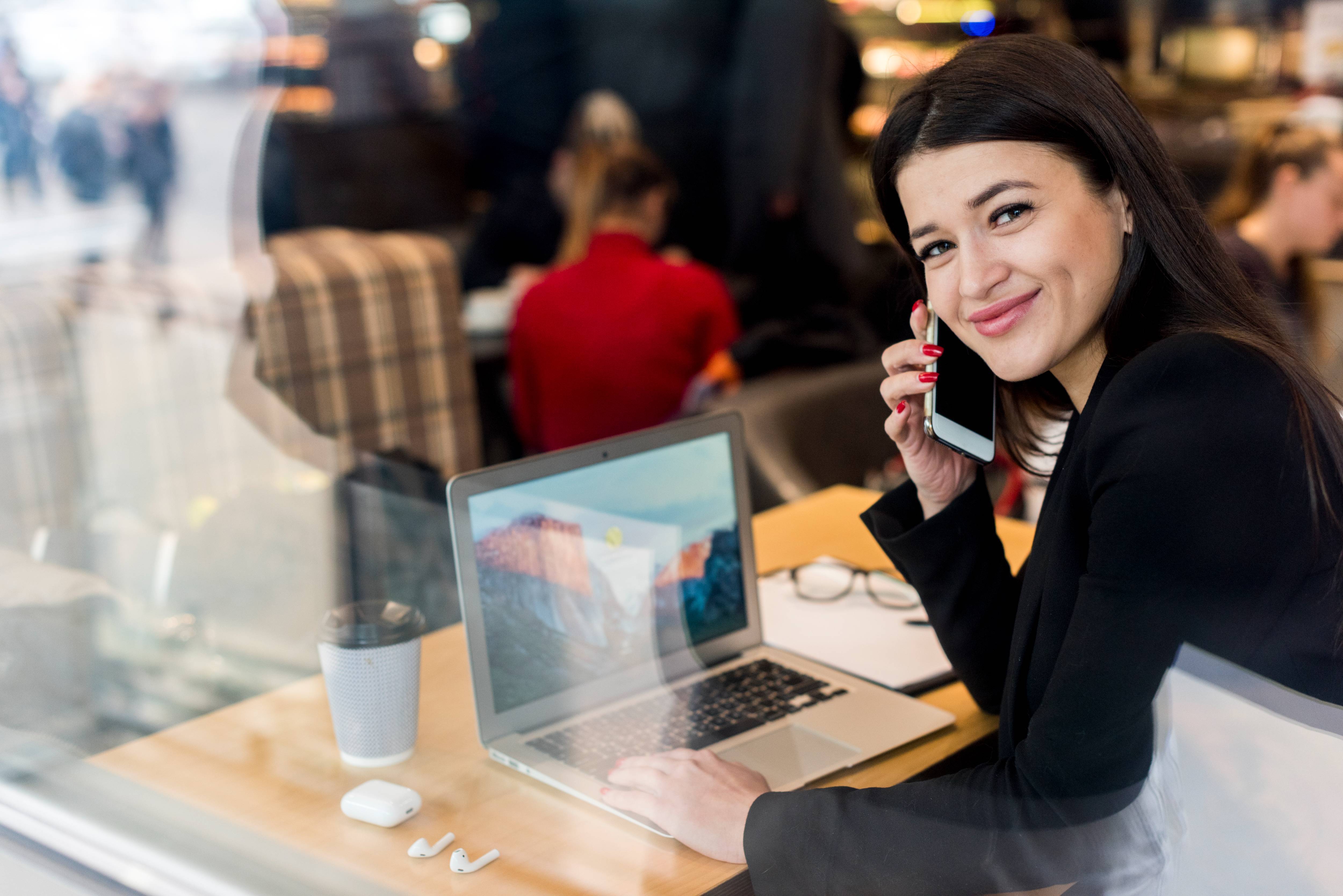 brunette-businesswoman-using-her-smartphone 2